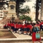Uniformed schoolchildren visit a historical monument, Guayaquil, Ecuador, in 1989.