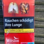 I'm not sure how to translate this other than "Smoking fucks up your lungs." A graphic cigarette pack thrown on the ground in Hoenheim, north of Strasbourg, France. Most cigarettes come from Germany, where they are cheaper because they are taxed less than in France. Germany is just over the bridge from Strasbourg. There are a lot of smokers in France, who seem undeterred by the images, and who also disproportionately throw litter on the ground. Was tut man? The image compares a healthy lung vs. a smoker's lung.