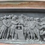One of the panels at the base of the statue of Gutenberg in Place Gutenberg, near the Cathedral. Gutenberg spent part of his career in Mainz, and part in Strasbourg. He invented the printing press, which forever changed the ability to preserve and spread information and ideas. This panel shows the men who signed the American Declaration of Independence, with Benjamin Franklin holding the declaration. The continental congress did not have a printing press, but it was the printing press that spread the word of independence and changed world history. One eventual result was the end of slavery (lower right).