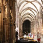 Votive candles and vaulted ceiling inside the Cathedral at Strasbourg.