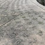 These are the marks of the illiterate medieval workmen who built the cathedral in Strasbourg, so that accurate records could be kept in order to pay them.