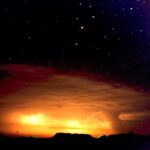 Nocturnal time lapse photo of a receding storm in the Badlands of South Dakota. This is a real photo.