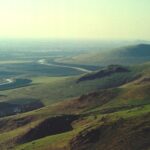 Irrigation allows the San Joaquin Valley of California (here, in Lindsay) to have abundant agriculture, primarily oranges. The Friant-Kern Canal follows the base of the Sierra Nevada foothill northward.