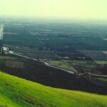 Irrigation allows the San Joaquin Valley of California (here, in Lindsay) to have abundant agriculture, primarily oranges. The Friant-Kern Canal follows the base of the Sierra Nevada foothill southward.