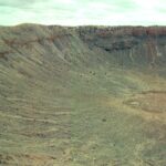 Barringer Crater (Meteor Crater) in Arizona, formed by a meteorite about 50,000 years ago. The lack of extensive rainfall has prevented the crater from eroding away.