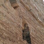 Reconstructed walls from Chaco Canyon, where the Anasazi civilization flourished until the 1300s of our calendar. This Native civilization developed and declined entirely without European contact. We do not know what they called themselves; Anasazi is the Navajo name for them. The walls were constructed of large and small sandstone tiles fitted tightly together. Tree trunks supported floors and ceilings. Study of tree rings in the beams allowed archaeologists to determine the date at which the buildings were constructed.
