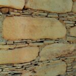Reconstructed walls from Chaco Canyon, where the Anasazi civilization flourished until the 1300s of our calendar. This Native civilization developed and declined entirely without European contact. We do not know what they called themselves; Anasazi is the Navajo name for them. The walls were constructed of large and small sandstone tiles fitted tightly together.