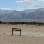 The Manzanar detention facility housed American citizens of Japanese descent during World War Two. They were treated kindly but had no rights. The facility fell into disrepair after the war but has recently been reconstructed. It was in the rain shadow desert east of the Sierra Nevada in California. All that remains of most of the buildings is the foundation.